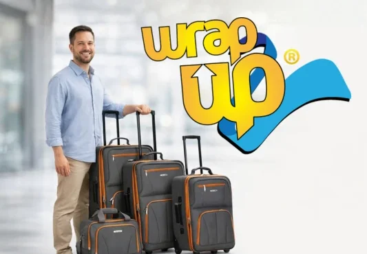 Adult traveler standing next to affordable luggage sets with softside rolling suitcases in a modern airport setting