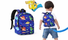 Toddler backpack with safety leash shown from front and back, compact travel option often compared to a rolling suitcase for family trips
