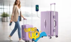 Hard shell suitcase with wheels and charging port used at an airport, ideal as best luggage for digital nomads