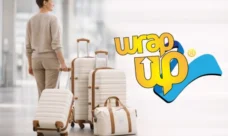 Traveler pulling modern luggage sets with built-in locks at airport terminal