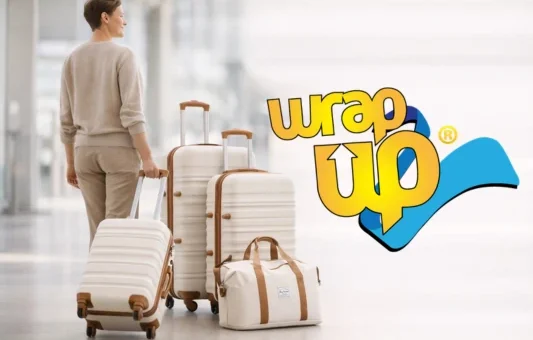 Traveler pulling modern luggage sets with built-in locks at airport terminal