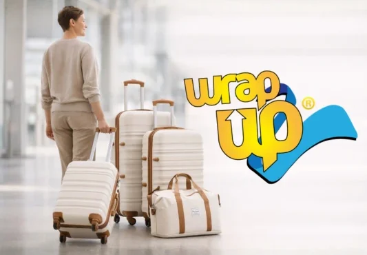 Traveler pulling modern luggage sets with built-in locks at airport terminal