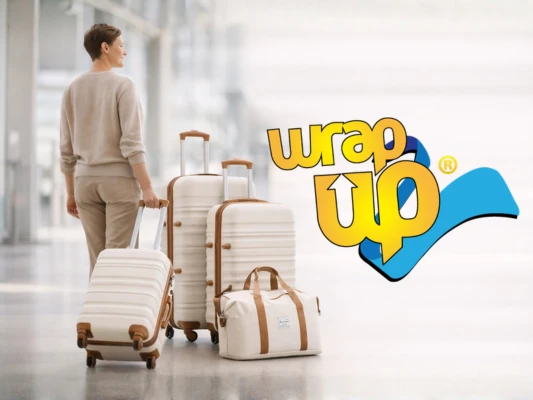 Traveler pulling modern luggage sets with built-in locks at airport terminal