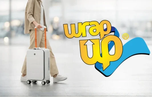 Traveler pulling hard shell carry on in airport, ideal best cabin luggage Europe size compliant