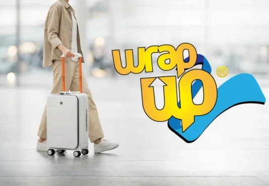 Traveler pulling hard shell carry on in airport, ideal best cabin luggage Europe size compliant