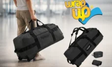 Person carrying rolling duffel bag in airport, best long travel luggage option for extended trips