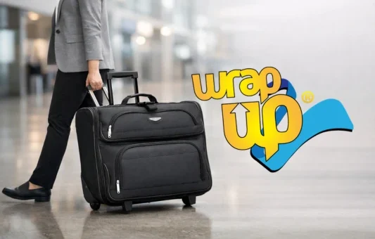 Professional traveler pulling a rolling garment bag through an airport terminal for business travel