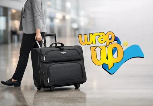 Professional traveler pulling a rolling garment bag through an airport terminal for business travel