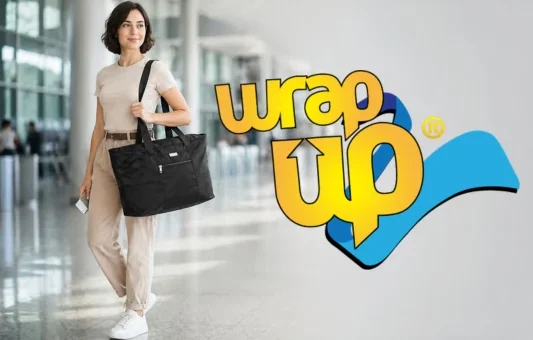 Traveler carrying the best packable travel tote in an airport terminal with extra storage space for trips