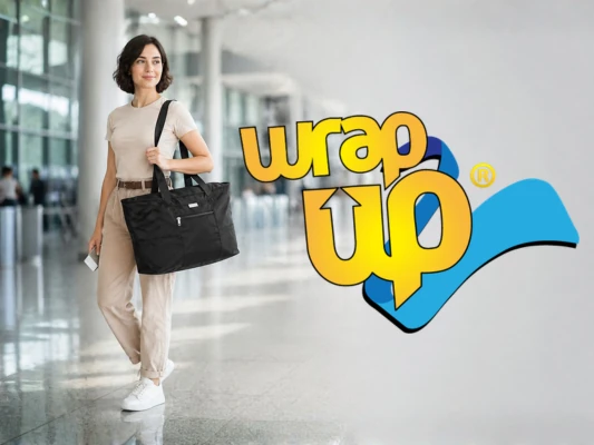 Traveler carrying the best packable travel tote in an airport terminal with extra storage space for trips