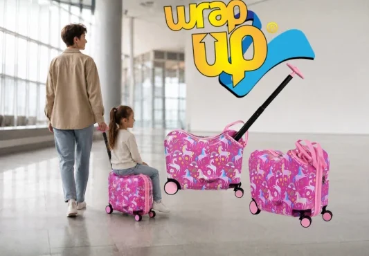 Girl riding kids ride-on luggage set while an adult pulls it through a modern airport