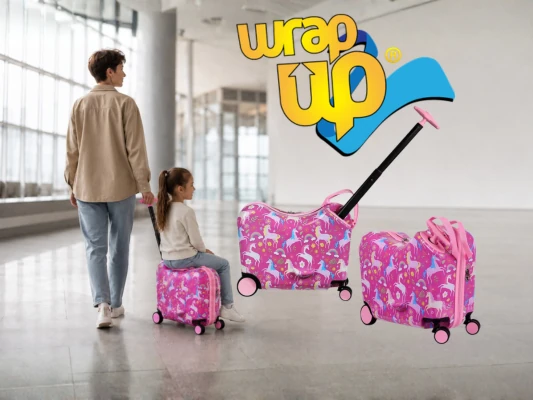 Girl riding kids ride-on luggage set while an adult pulls it through a modern airport