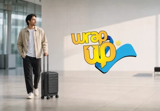 Traveler pulling expandable luggage with straps in a modern airport terminal