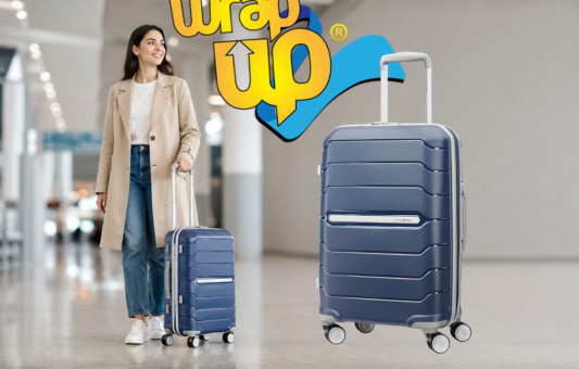 Adult traveler pulling smart hard shell luggage through a modern airport terminal with organized travel style
