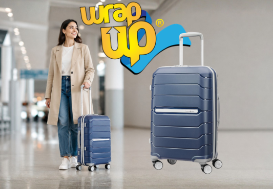 Adult traveler pulling smart hard shell luggage through a modern airport terminal with organized travel style