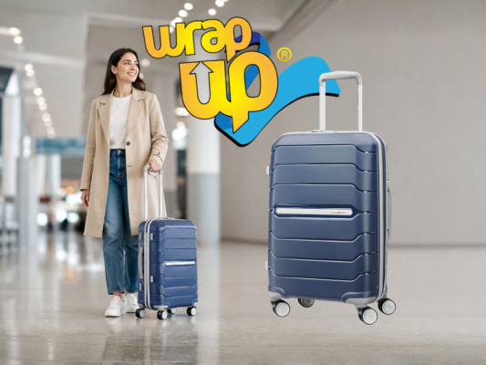 Adult traveler pulling smart hard shell luggage through a modern airport terminal with organized travel style
