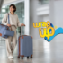 Woman traveling with rolling suitcase and matching bags, ideal luggage for solo women at the airport.