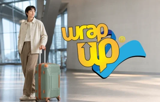 Traveler with durable luggage with reinforced corners in a modern airport terminal