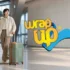 Traveler with durable luggage with reinforced corners in a modern airport terminal