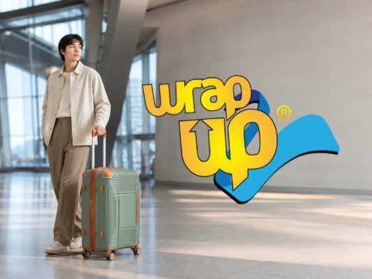 Traveler with durable luggage with reinforced corners in a modern airport terminal