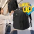 Passenger placing a best slim travel backpack in an airplane overhead compartment