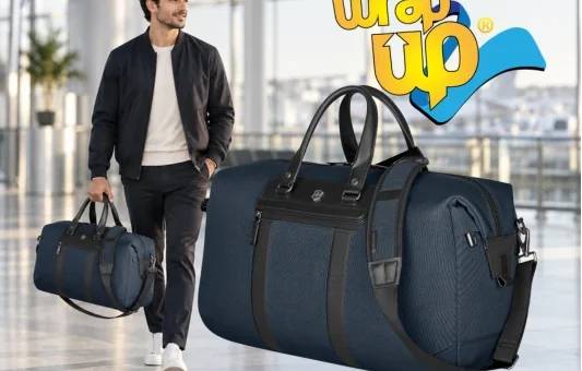 Traveler carrying a carry-on weekender bag through a modern airport terminal