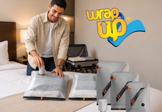 Traveler using compression travel storage bags on a bed while organizing clothes for a trip.