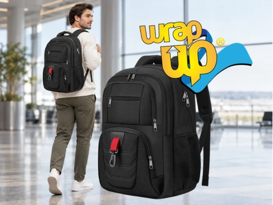 Traveler wearing a student backpack with compartments inside a modern airport terminal