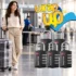 Traveler with plastic-wrapped luggage and a combination lock near an airport security checkpoint.